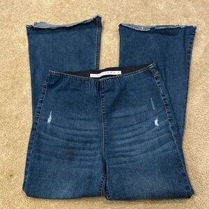 Distressed flare elastic waist jeans